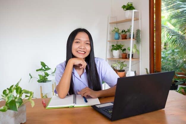 Student girl study by slfe on laptop in room