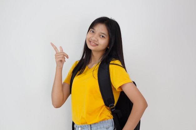 Student girl with backpack smilling on white background