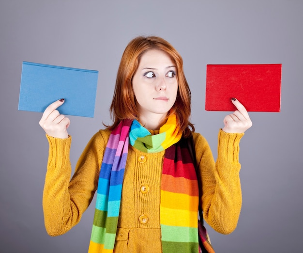 Student girl with two books. 