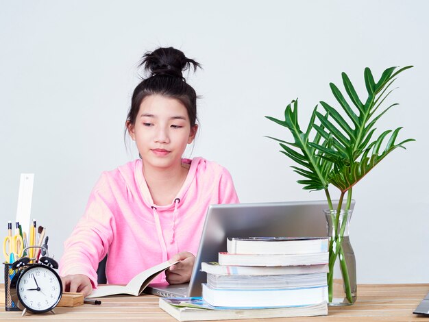 Student girl working on laptop.