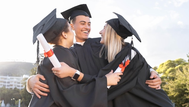 Student graduation friends and hug for celebration success and certified education event outdoor Diversity smile and excited graduates celebrate at happy campus university goals or study support