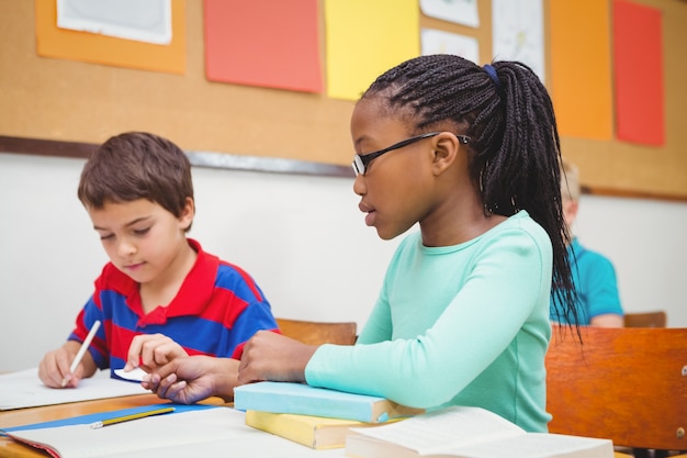 Student helping fellow student in class