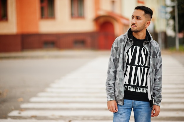 Student kuwaiti man wear at hoodie walking crosswalk