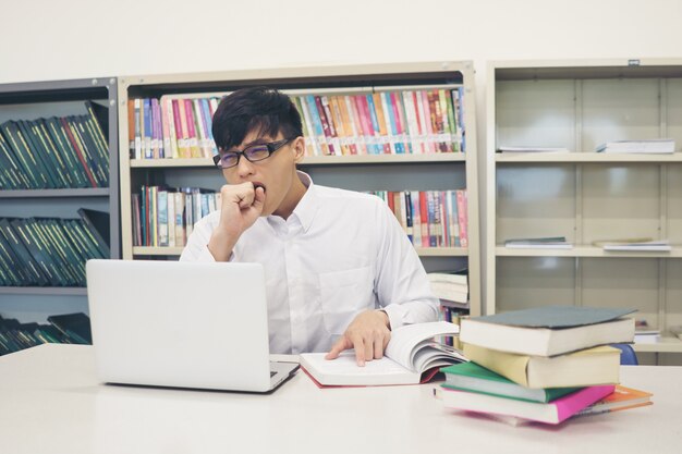 Student making research on laptop and browse internet. Education concept.