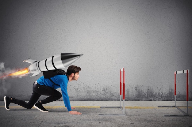 Photo student overcomes obstacles of his studies at top speed with a rocket