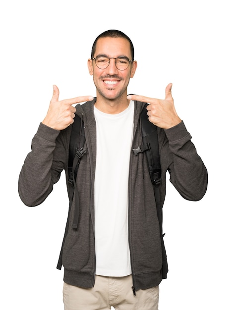 Student pointing to his teeth