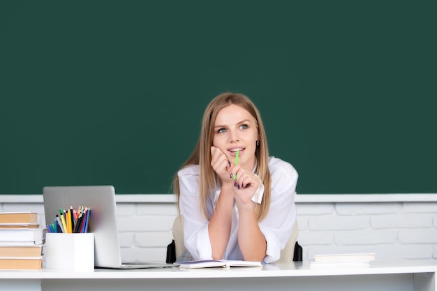 Student preparing exam and learning lessons in school interior college classroom class in university