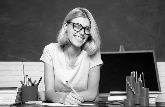 Student preparing for test or exam portrait of confident young caucasian female teacher student and