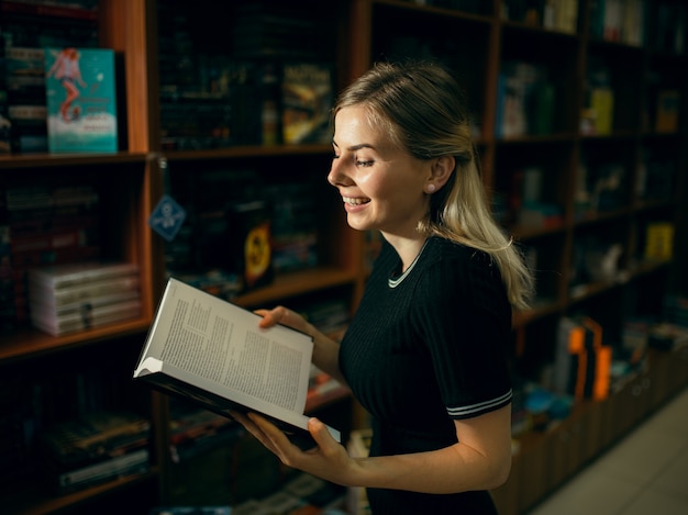 Student reading a book in the library