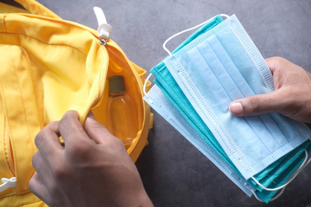 Student school bag pack with sanitizer, a face mask.