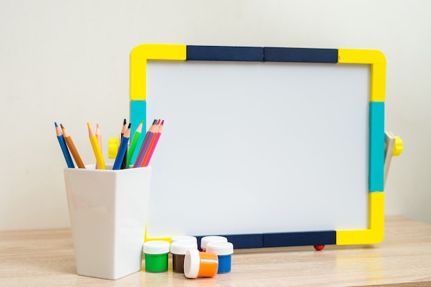 Student school desk mock up with colorful office supplies back to school