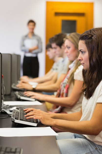 Student sitting at the computer concentrating 