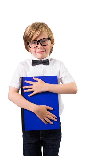 Student smiling and holding notebook