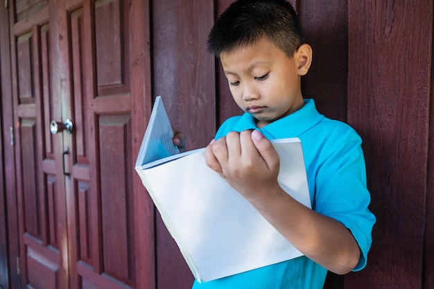 Student standing Read school books