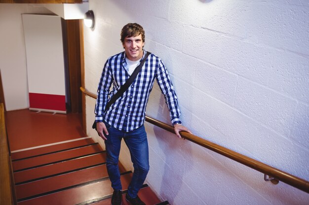 Student standing on staircase