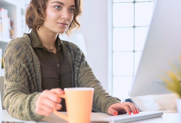 Student studying and learning online with a laptop in a desk at home