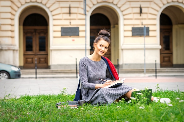 Student studying with book