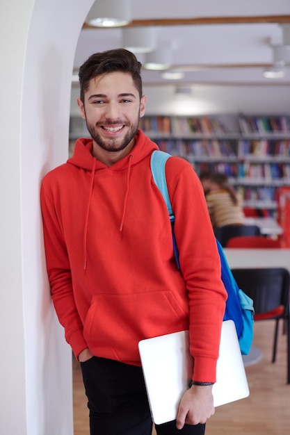 the student uses a laptop and a school library
