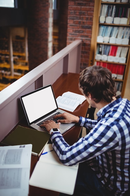 Student using laptop in library