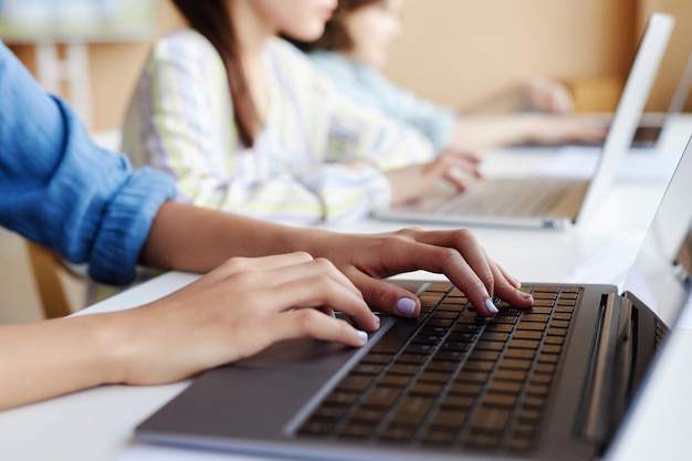 Photo student using laptop in study