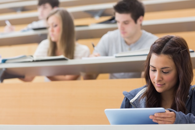 Student using tablet pc to take notes