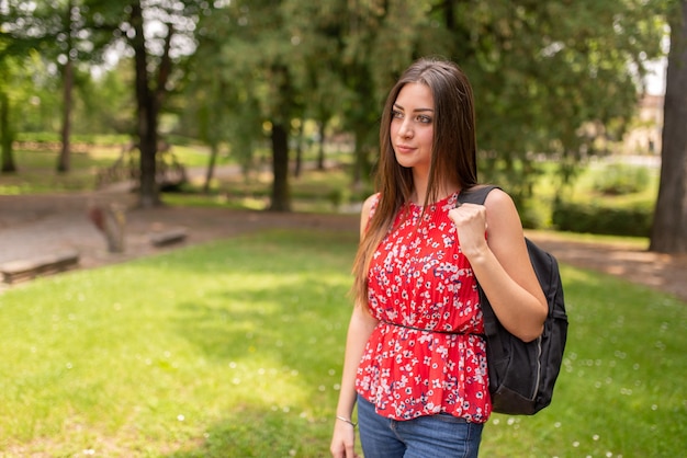 Student walking in a park in spring