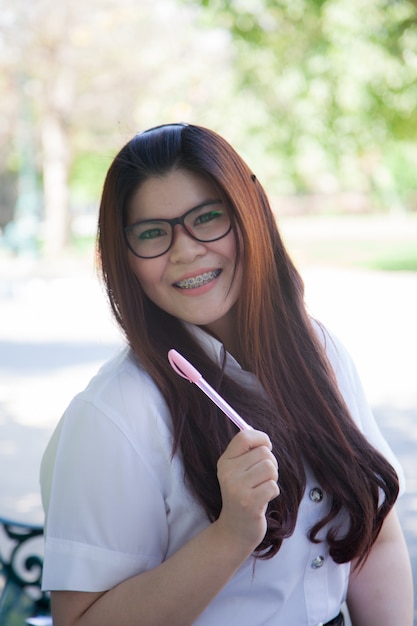 Student wearing glasses smiling