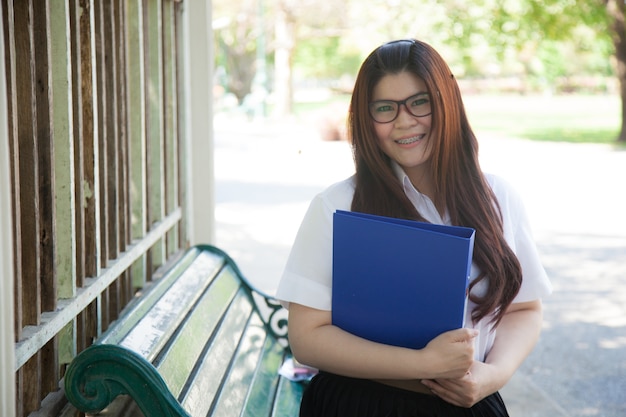 Student wearing glasses that hold documents