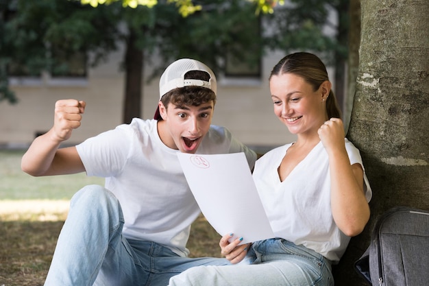 Photo students celebrating good results on exam