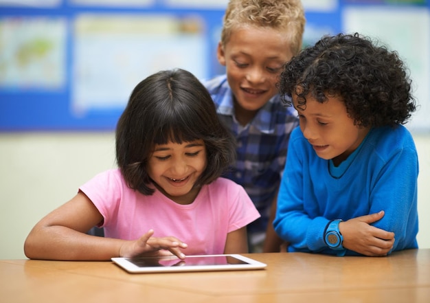 Photo students children on tablet and school for online education e learning and website or information in group happy kids in diversity with digital technology for knowledge and classroom development