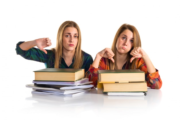 Students doing a bad signal while studying