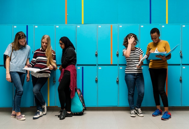 Students friends at lockers room