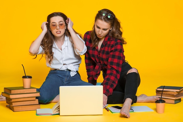 Students girls Happy young woman Students with notebooks on yellow Student at the college