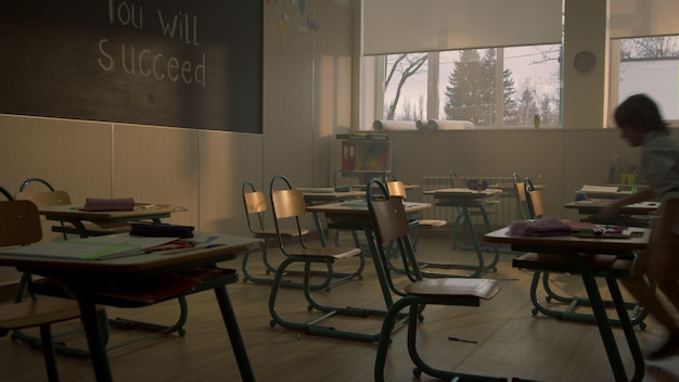 students running in classroom for lesson multi ethnic pupils talking in class