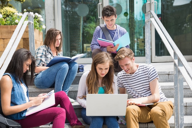 Students sitting on steps studying