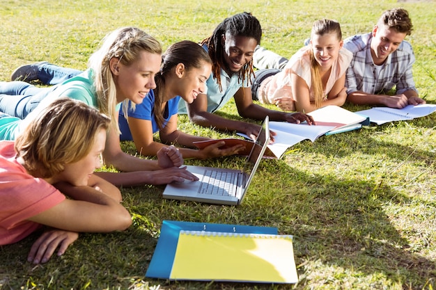 Students studying outside on campus