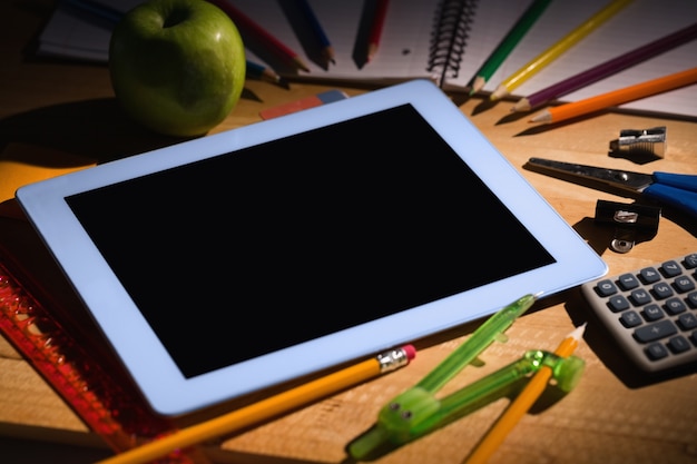 Students table with school supplies