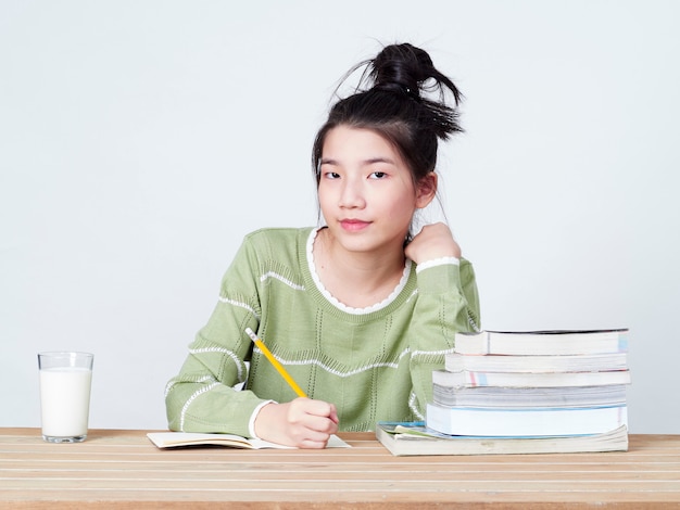 Students do their homework at table.