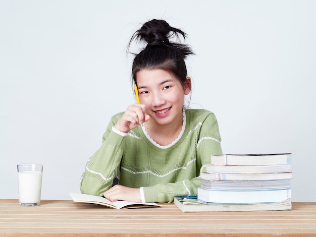 Students do their homework at table.