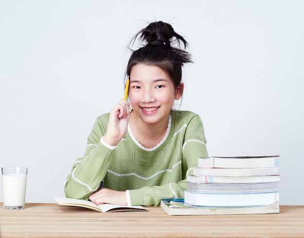 Students do their homework at table.