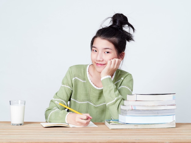 Students do their homework at table.