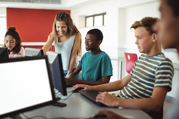 Students using computer in classroom