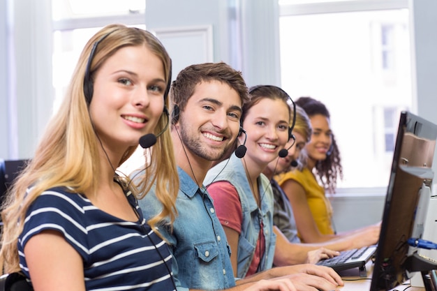 Students using headsets in computer class