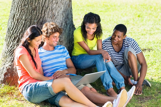 Students using laptop on college campus