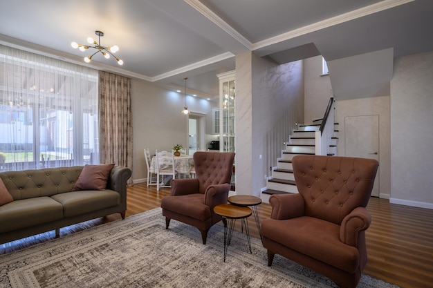 Studio apartment living room with white large kitchen and dining table