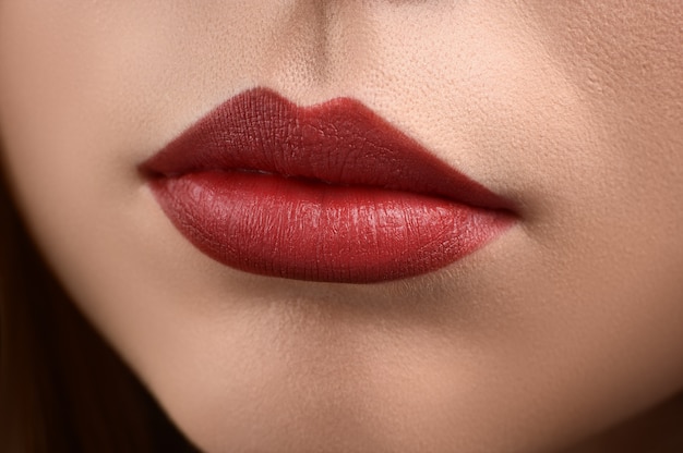 Studio close up of plump lips with make up.