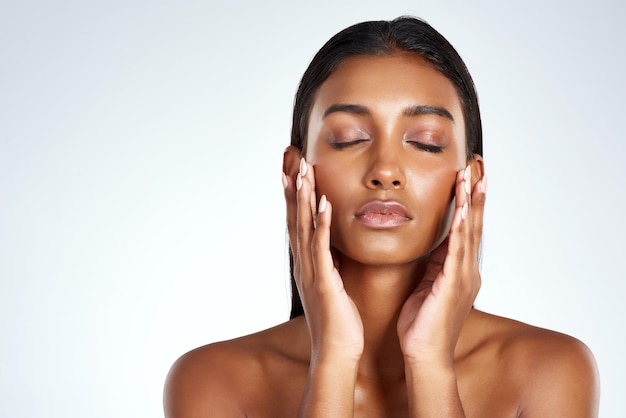 studio face and beauty with indian woman hands and cosmetic or makeup cosmetology skin and beautician with confidence for female model dermatology and salon treatment for skincare with mockup