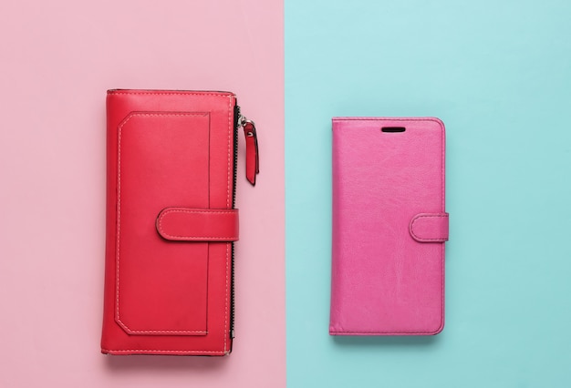スタジオファッションは、革のケースに赤い財布のスマートフォンを撮影しました