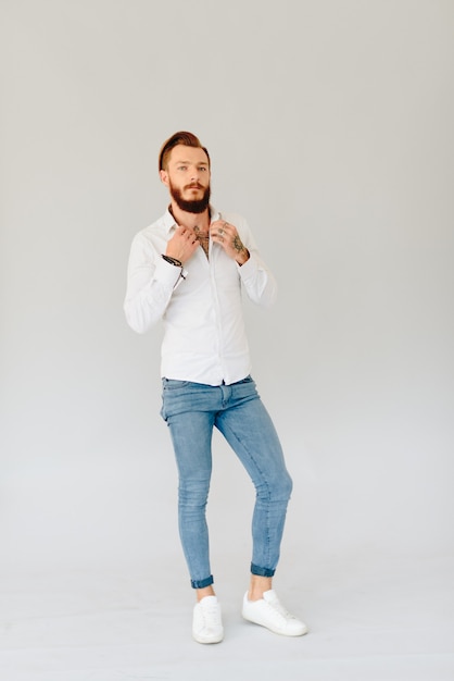 Studio photo of a beautiful young man with a beard