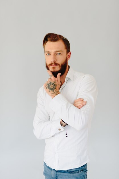 Studio photo of a beautiful young man with a beard